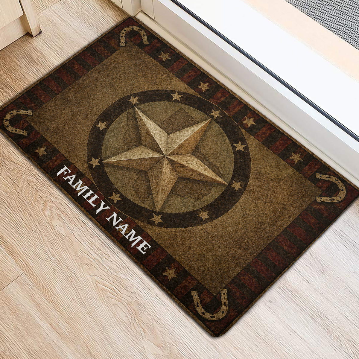 Rustic Texas star and horseshoe door mat displayed by an interior doorway on light wood flooring
