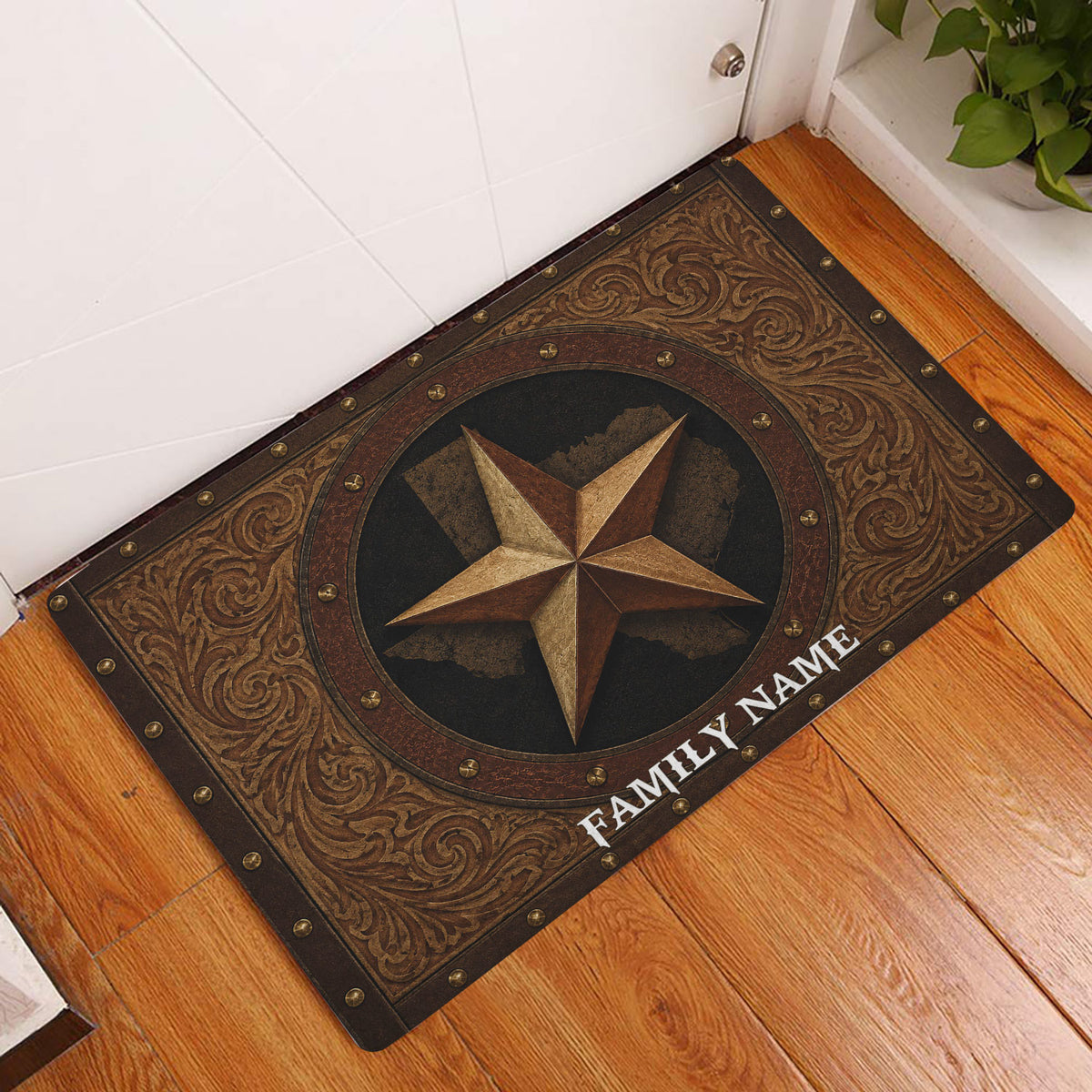 Texas star entryway doormat displayed on a warm wood floor beside a white door
