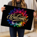 Woman holding a colorful sunflower welcome doormat indoors to show the full floral artwork