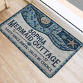 Mermaid door mat shown at an entrance with a teal and navy tail, seashells, starfish, and coastal details