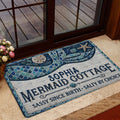 Mermaid doormat styled at a home entrance with ocean artwork, a decorative border, and coastal colors