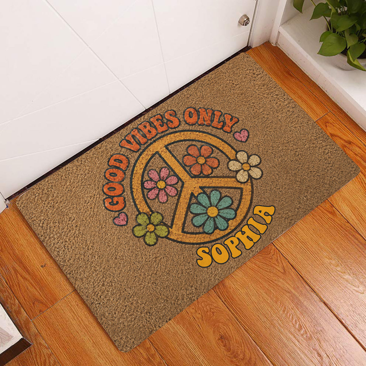 Colorful hippie peace sign flower doormat displayed at a home entryway