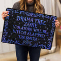 Person holding a black Wicca doormat featuring blue celestial symbols and ornate witchy artwork
