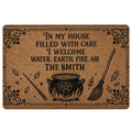 Wicca doormat with black cauldron, broom, wand, crystals, pentagram and ornate botanical border