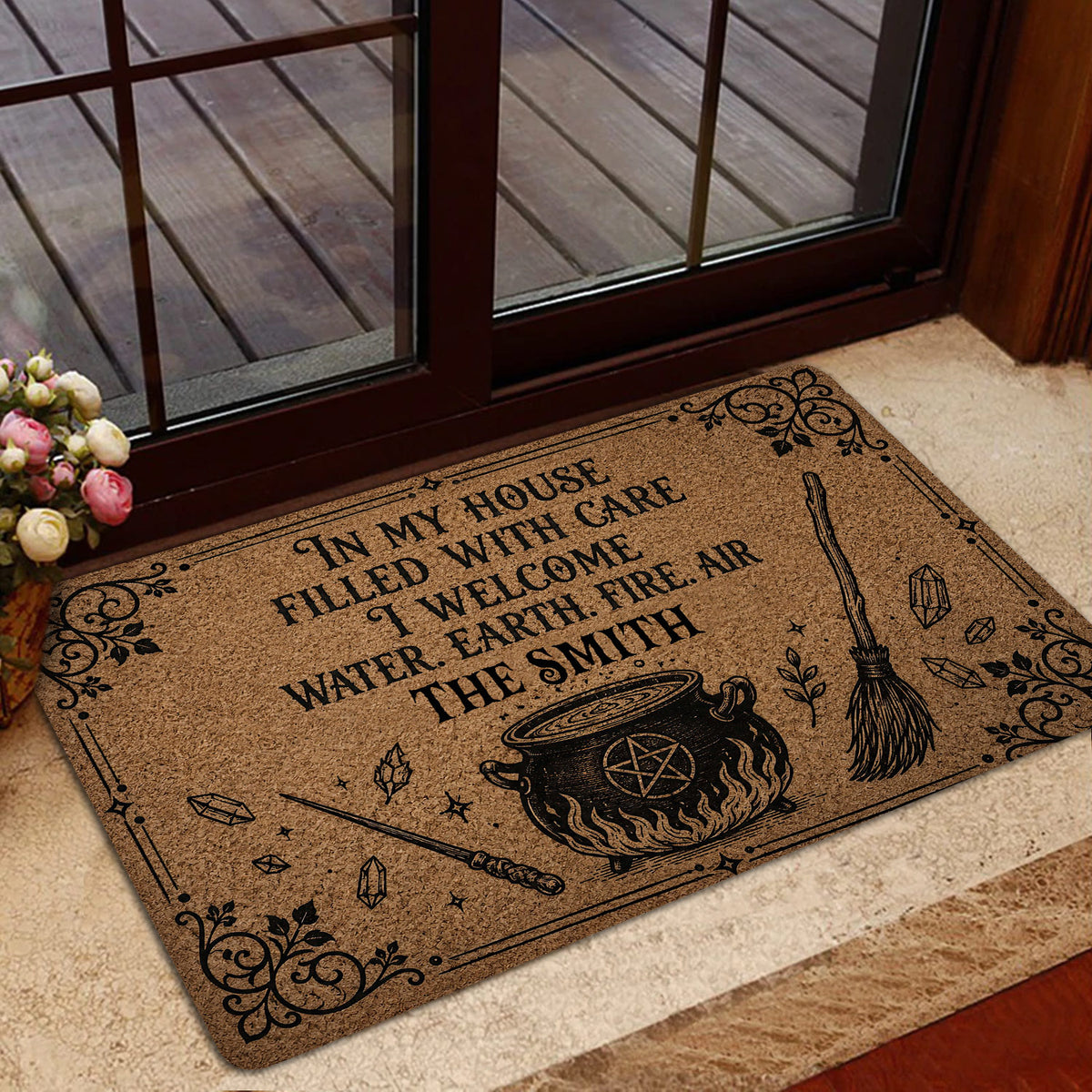 Wicca door mat in a home entrance featuring elemental witchcraft artwork and ornate black details