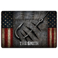 Fishing doormat featuring a large metal hook, rugged steel texture, stars, and distressed red and cream stripes