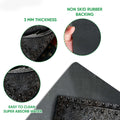 Close-up feature view of the fishing doormat surface, edge, and dark rubber backing