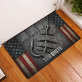 Fishing-themed doormat displayed in an entryway on a wood floor with a large hook and patriotic border