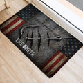 Fishing hook and rugged metal artwork doormat positioned beside a doorway on a light wood floor