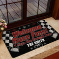 Racing doormat styled beside a glass door with checkered flags, beer mugs, and bold red and white lettering