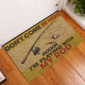 Fishing-themed doormat styled at a home entryway on a wood floor