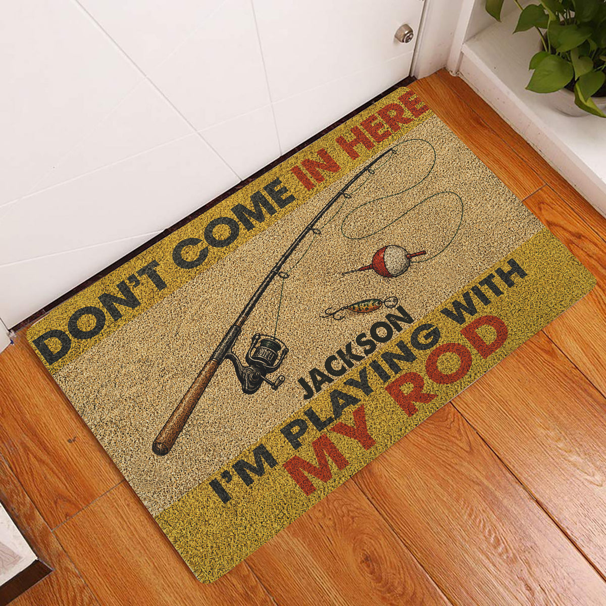 Fishing-themed doormat styled at a home entryway on a wood floor