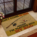 Fishing doormat displayed near a glass door with a wood deck visible outside