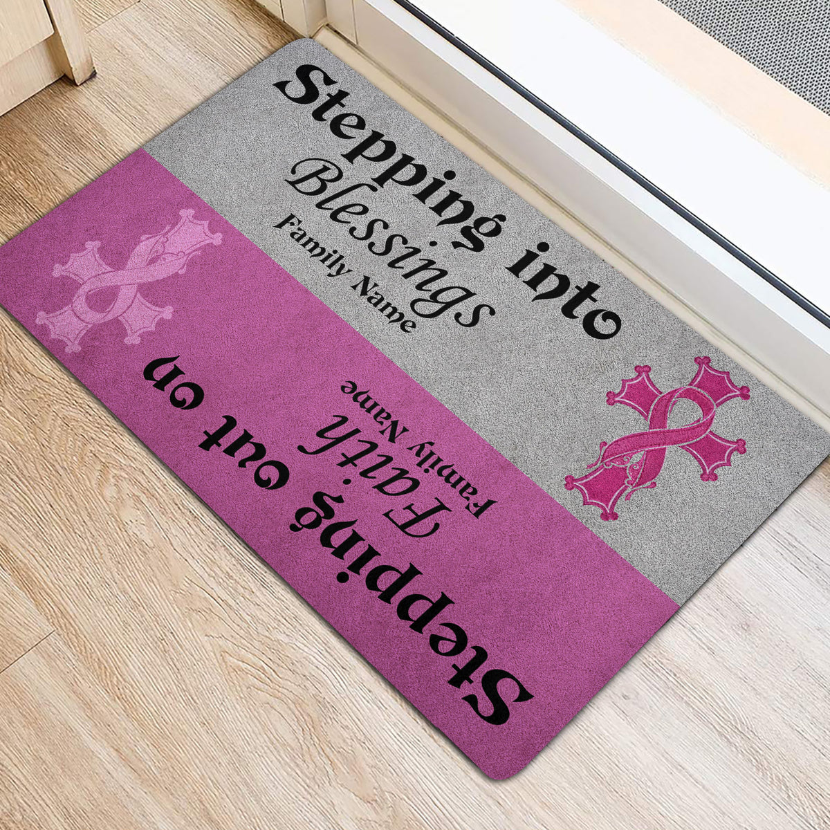 Pink and gray breast cancer ribbon door mat styled at an indoor entrance