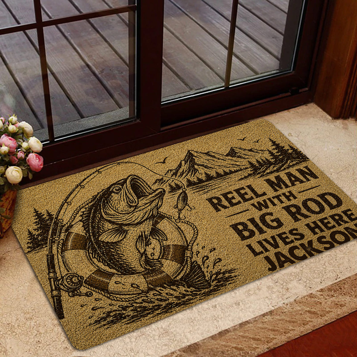 Fishing doormat styled in an entryway with fish artwork, mountain scenery, and a bold angler message