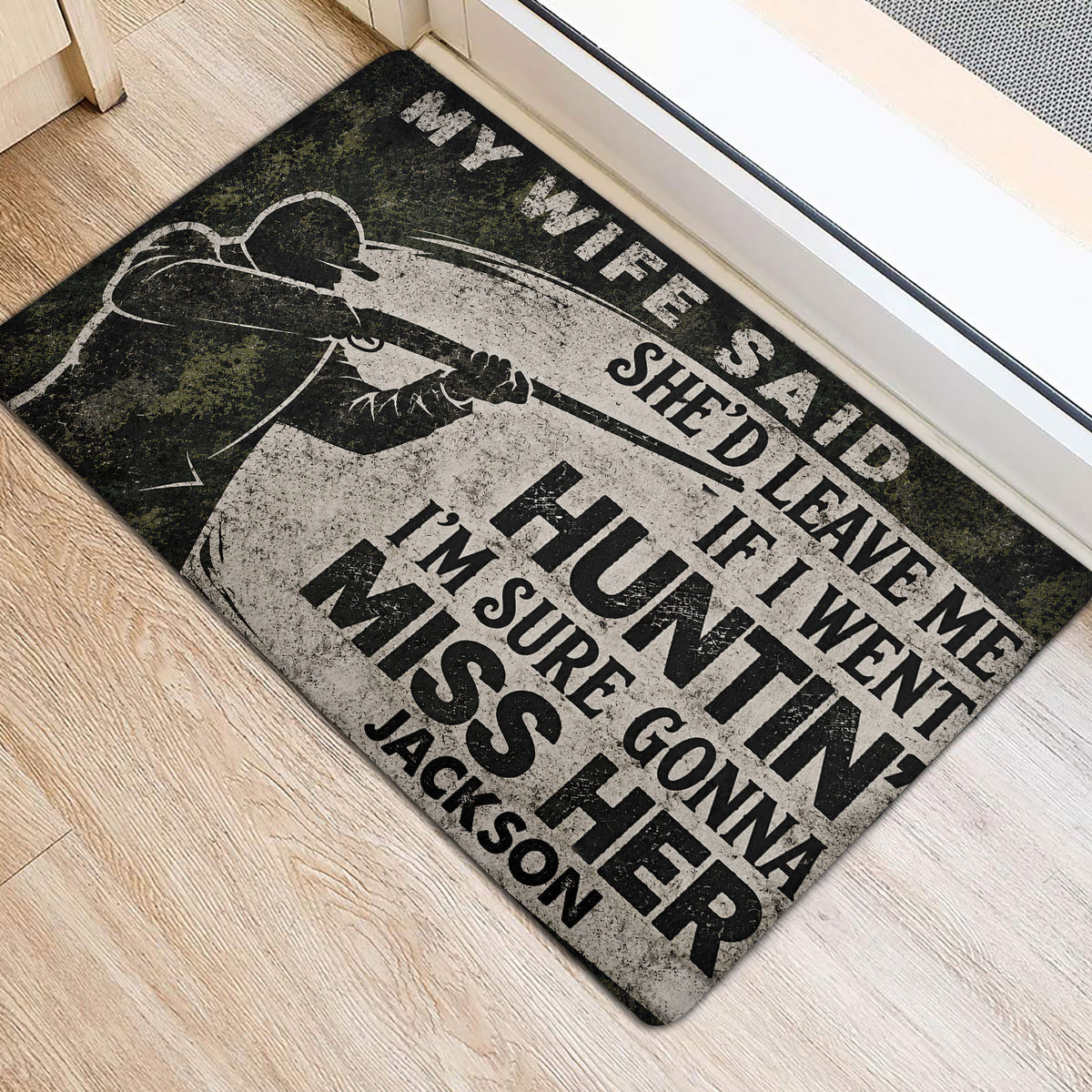 Hunter-themed door mat positioned at an entryway on light wood flooring