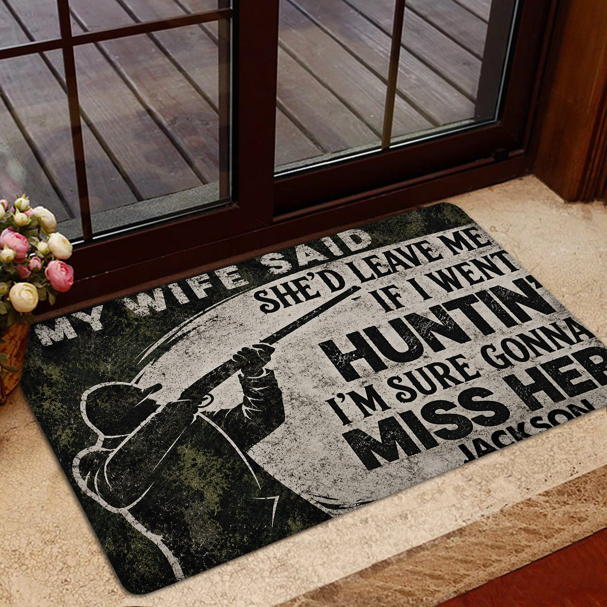 Hunting doormat styled inside a home entrance near a glass door and indoor rug