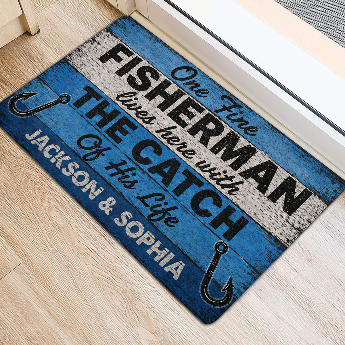 Blue and white fisherman doormat placed beside an interior doorway