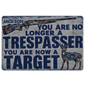 Hunting doormat featuring a detailed rifle, deer illustration, bold navy lettering, and a distressed gray design