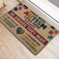 Autism support entryway rug shown beside a doorway with colorful puzzle pieces and awareness message
