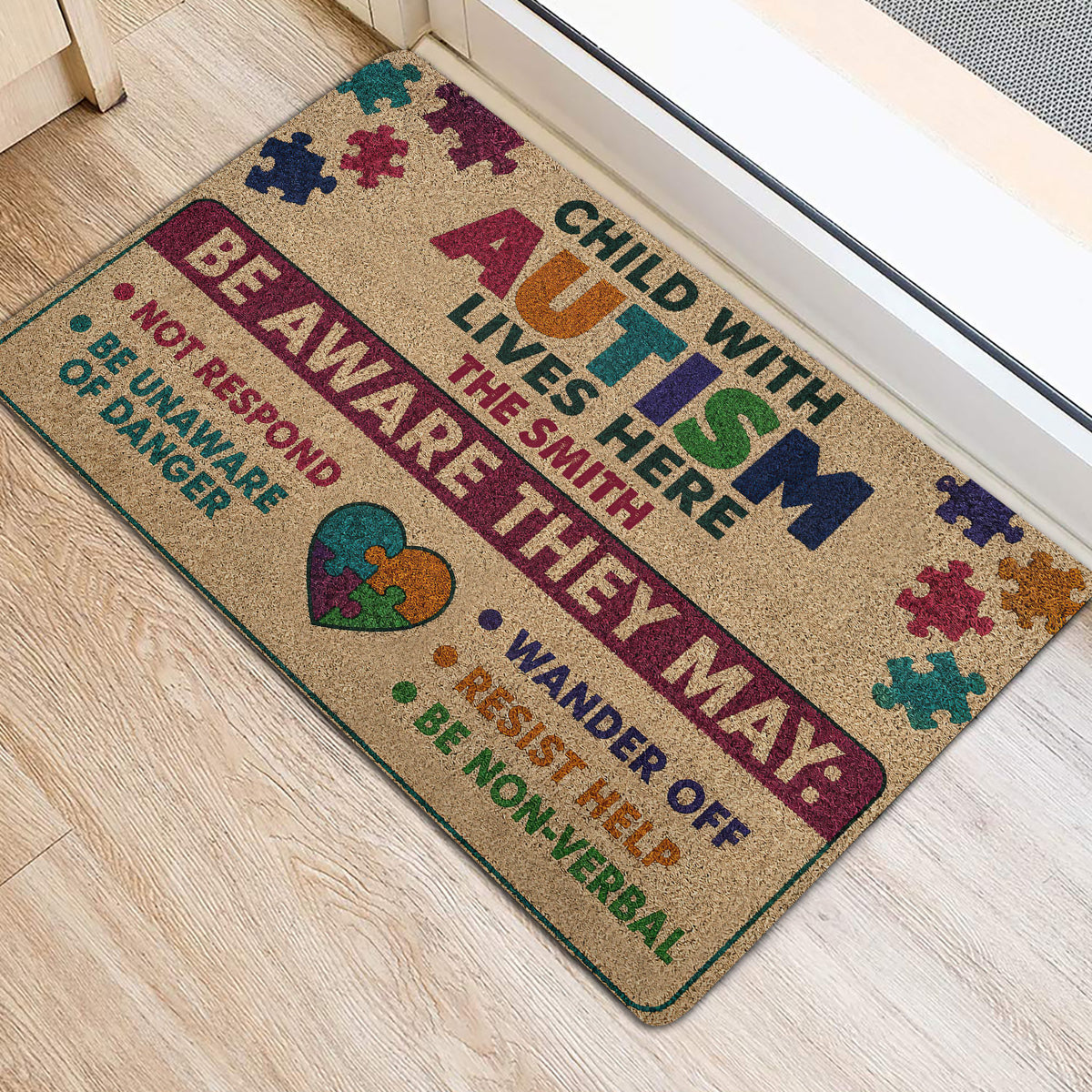Autism support entryway rug shown beside a doorway with colorful puzzle pieces and awareness message