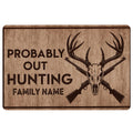 Rustic hunting doormat with deer skull, crossed rifles, bold hunting artwork, and warm brown woodgrain styling