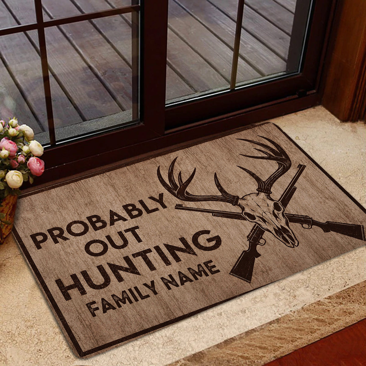 Hunting doormat with deer skull artwork styled inside a home doorway near a glass door