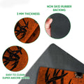 Close-up detail of the orange hunting mat surface and dark rubber underside with rounded edges