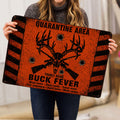 Person holding an orange and black hunting doormat featuring antlers, a buck skull and rifles