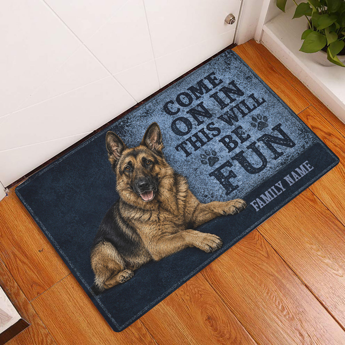 German Shepherd entryway doormat displayed beside a white door on a warm wood floor