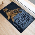 German Shepherd door mat styled at an indoor entrance with blue artwork and paw print accents