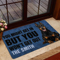 Blue Doberman entryway mat styled near glass doors with a realistic dog portrait