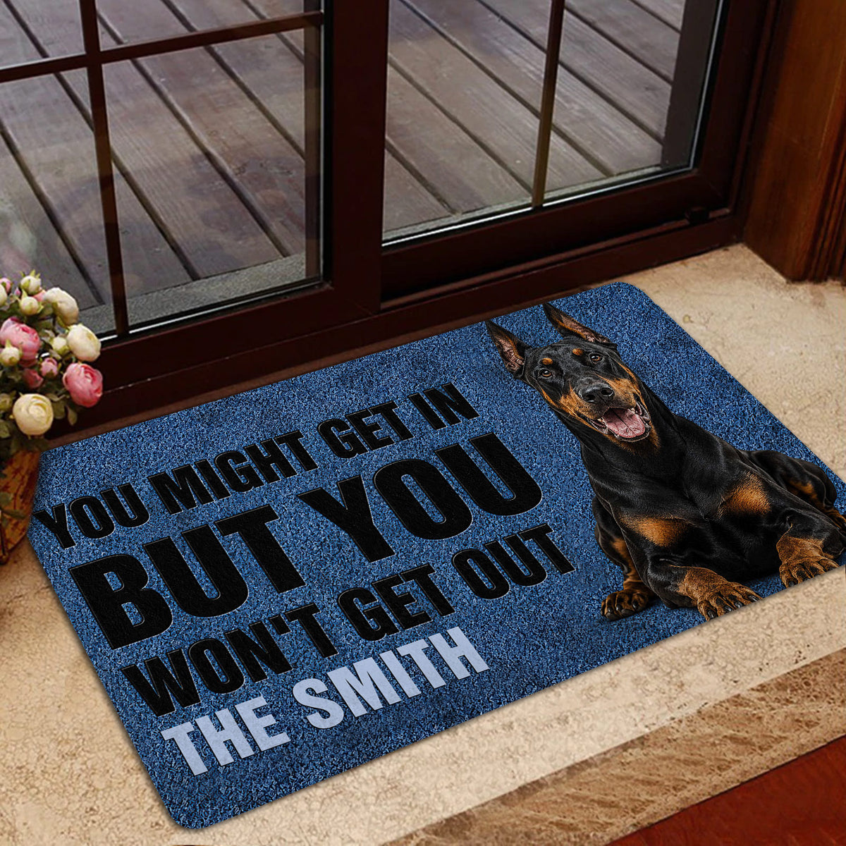 Blue Doberman entryway mat styled near glass doors with a realistic dog portrait