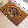 Inclusive rainbow LGBT door mat positioned at a bright home entrance