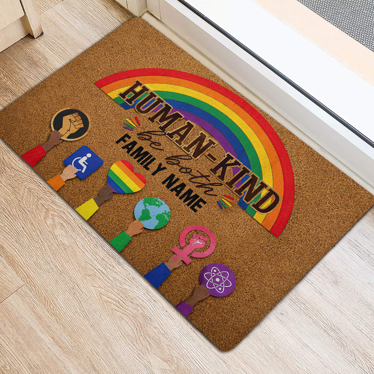 Inclusive rainbow LGBT door mat positioned at a bright home entrance