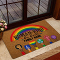 Rainbow pride doormat styled inside a glass doorway with a warm, welcoming design