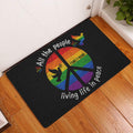 Rainbow LGBT peace dove doormat displayed at a home entrance on a warm wood floor