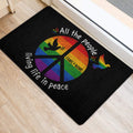 LGBT rainbow peace symbol door mat positioned inside a bright entryway near a doorway