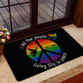 Colorful rainbow dove LGBT doormat styled in a welcoming home entrance beside a glass door