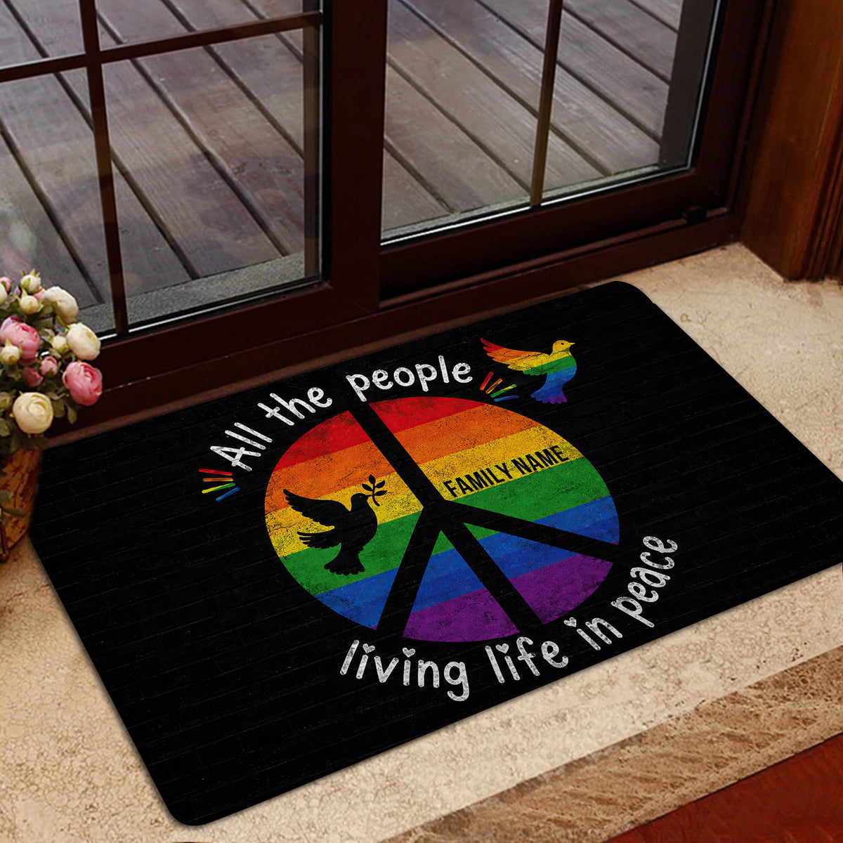 Colorful rainbow dove LGBT doormat styled in a welcoming home entrance beside a glass door
