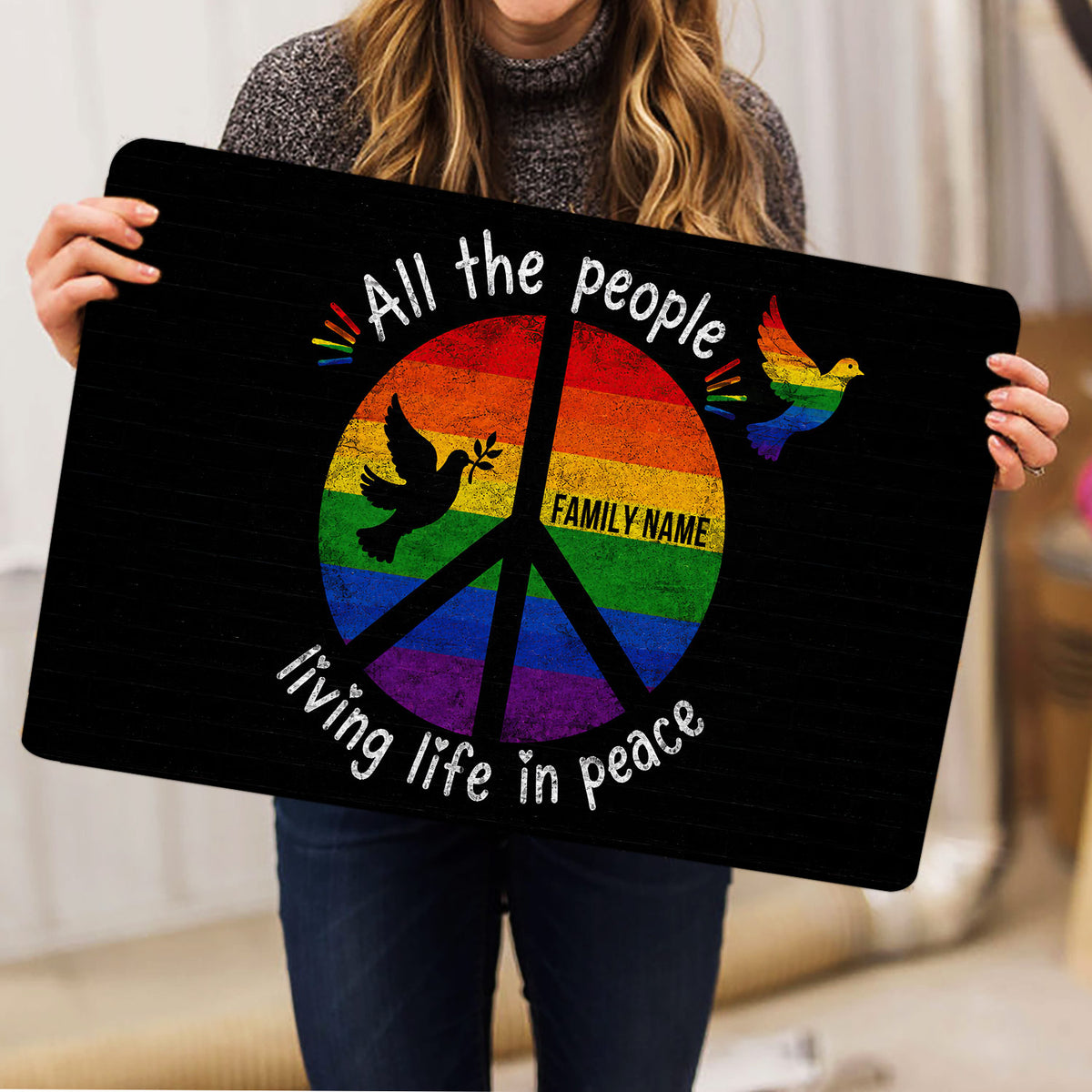 Rainbow LGBT peace dove doormat held upright to display its colorful inclusive artwork