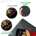 Close-up of rainbow flower doormat surface and dark rubber backing detail