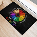 Colorful rainbow flower LGBT door mat styled at an indoor home entrance