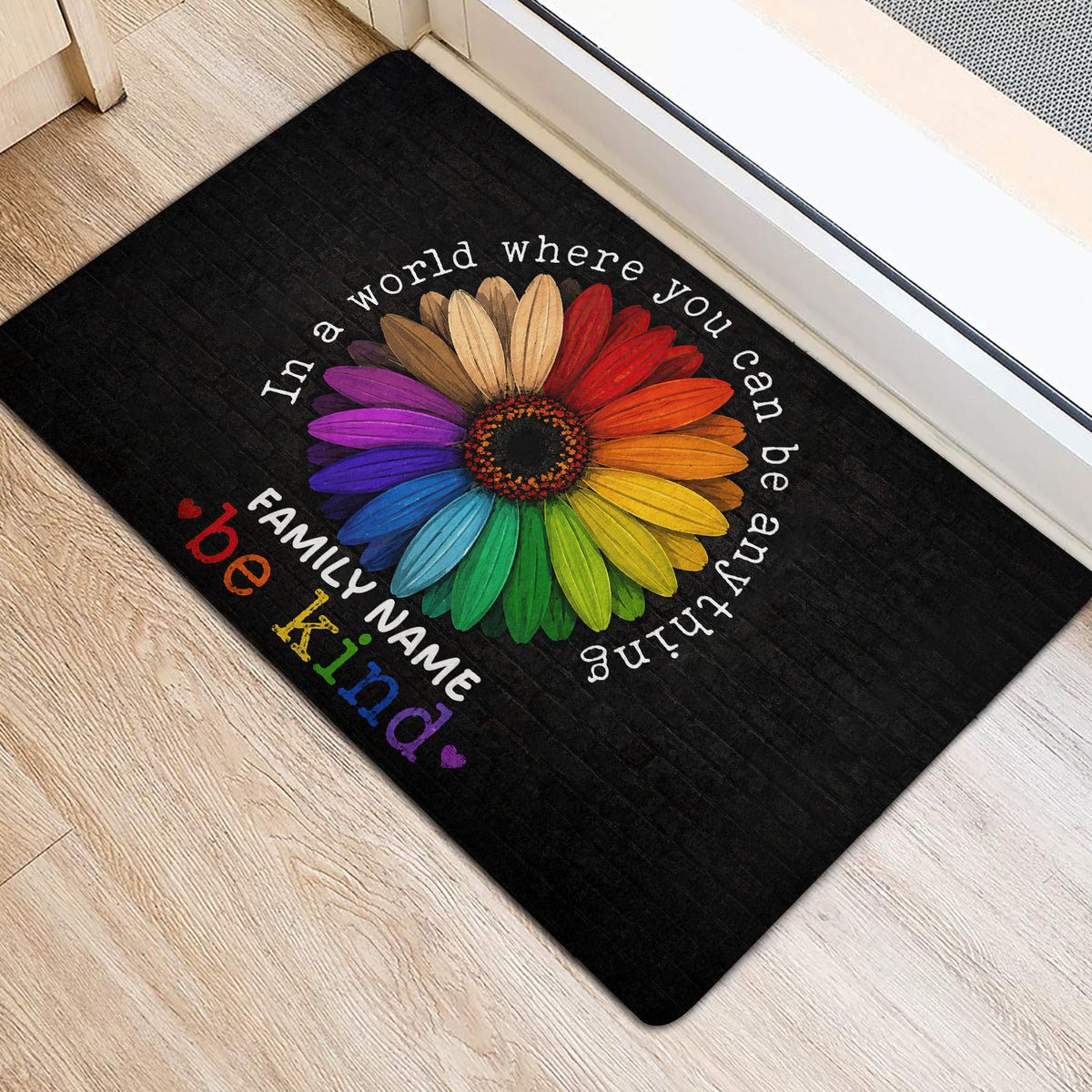 Colorful rainbow flower LGBT door mat styled at an indoor home entrance