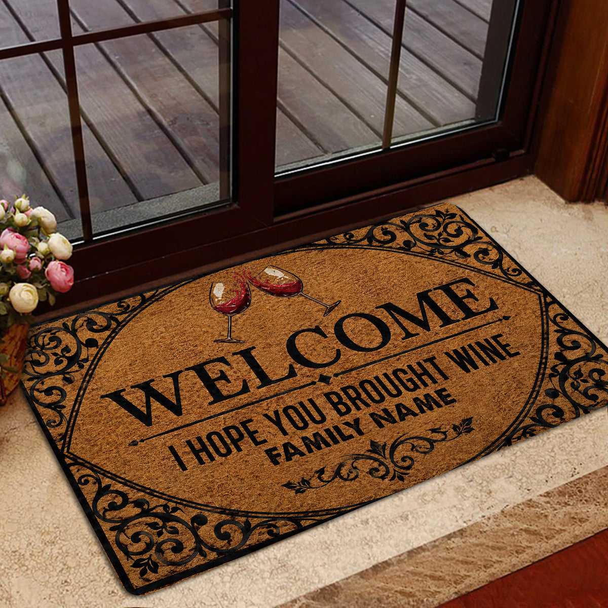 Wine entryway rug styled at a glass door with red wine artwork and decorative black border