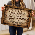 Person holding a rustic Christian God Bless This Home doormat in a home interior