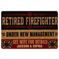 Firefighter doormat with black, red, and gold artwork, fire service emblems, and bold entryway lettering