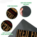 Close-up firefighter doormat showing the printed felt surface and black rubber backing detail