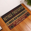 Firefighter doormat displayed at a home entrance on wood flooring with bold red, black, and gold artwork