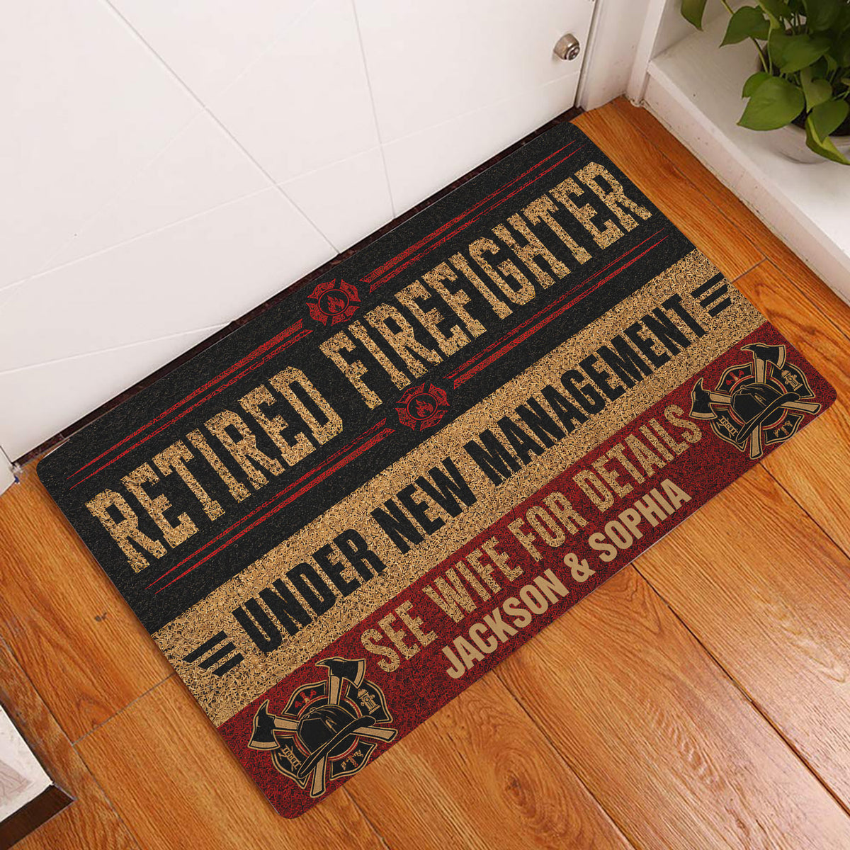 Firefighter doormat displayed at a home entrance on wood flooring with bold red, black, and gold artwork